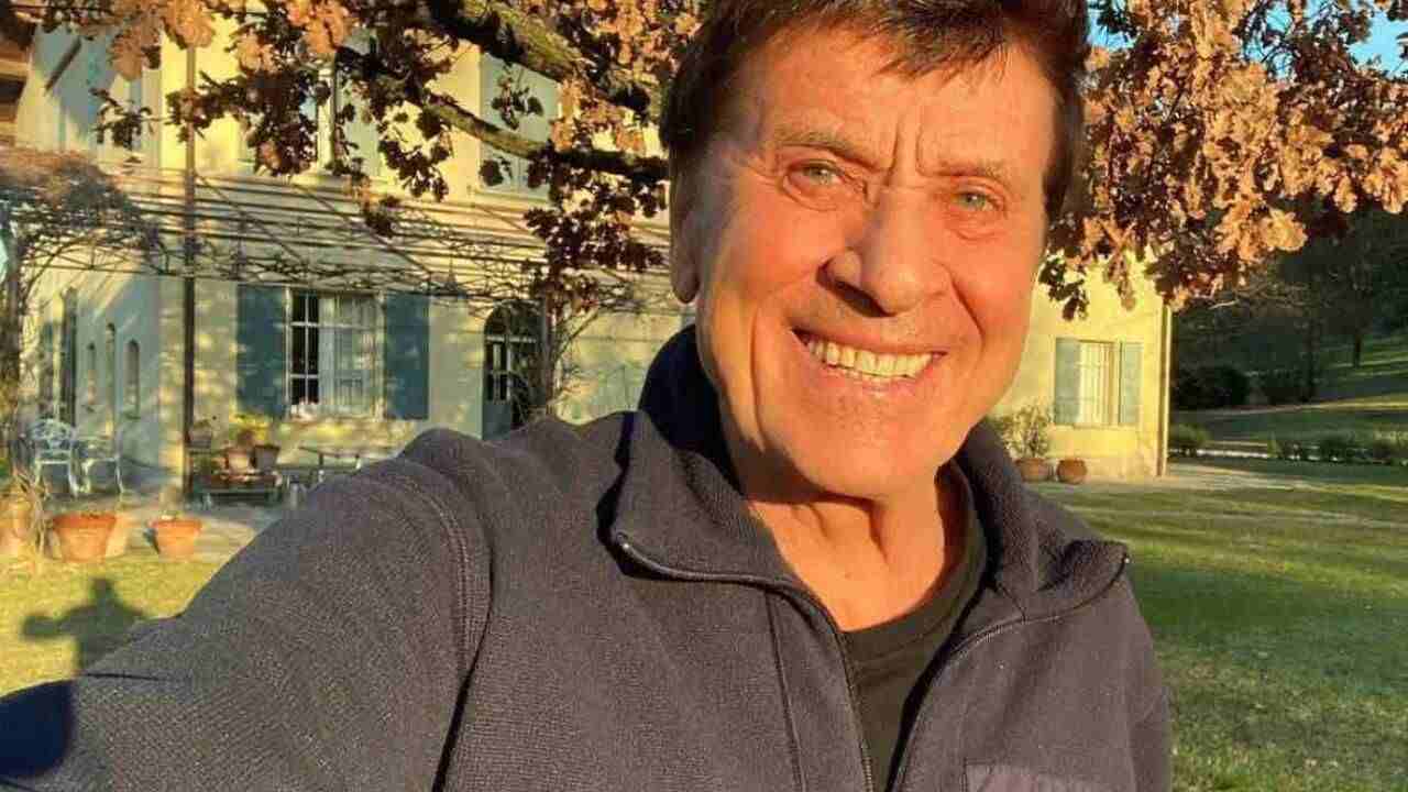 gianni morandi incidente mano fasciata suona chitarra